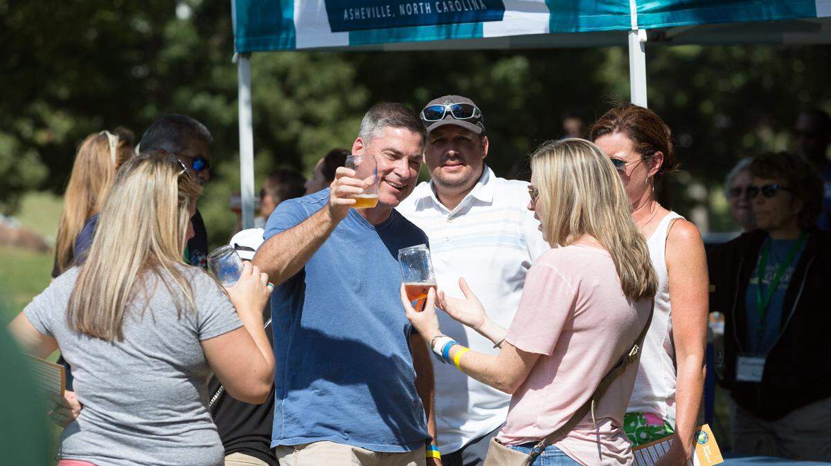 Visitors enjoy last year’s Anne Springs Close Greenway 12th annual Fiddle ‘N Pig Shindig. The 13th annual event will be Saturday at the greenway.