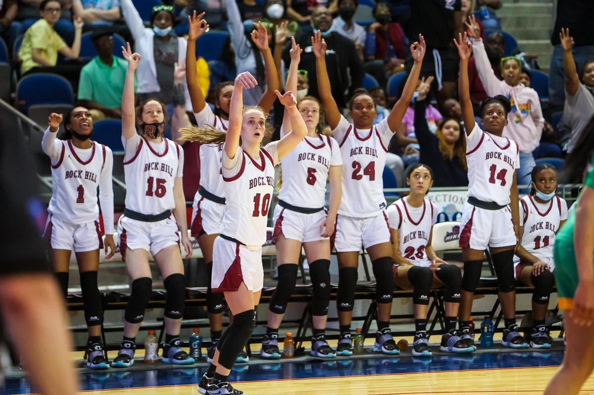 Rock Hill Bearcats Gracie Wilson (10) and the bench watch her successful three pointer in the Girls 5A State Championship Game at the University of South Carolina Aiken Thursday, March 3, 2022.