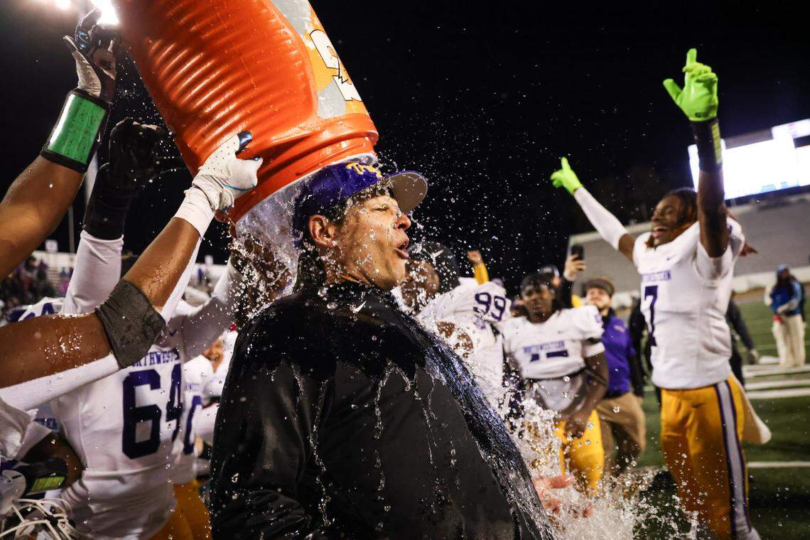 Northwestern head coach Page Wofford is doused with water following his team’s win over Irmo in the Class 5A-D2 football state championship game at Oliver Dawson Stadium in Orangeburg on Saturday, December 14, 2024.