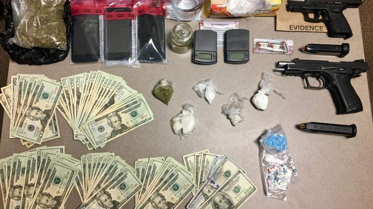 Police in Lancaster County seized drugs, weapons and cash in a raid Tuesday on Fairway Drive where three people were arrested for drug trafficking, officers said.
