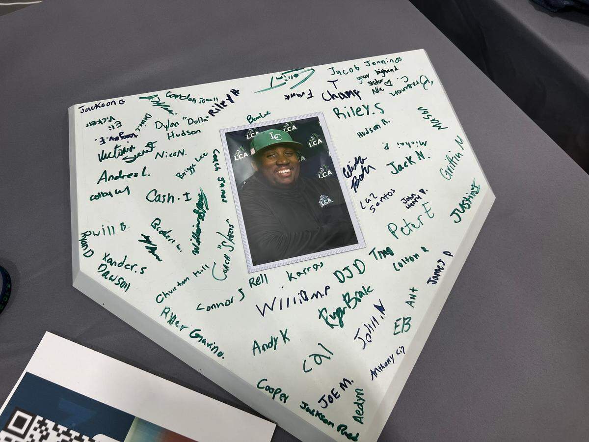 A baseball base signed by the Legion Collegiate Academy community in Jalen Benjamin’s honor.