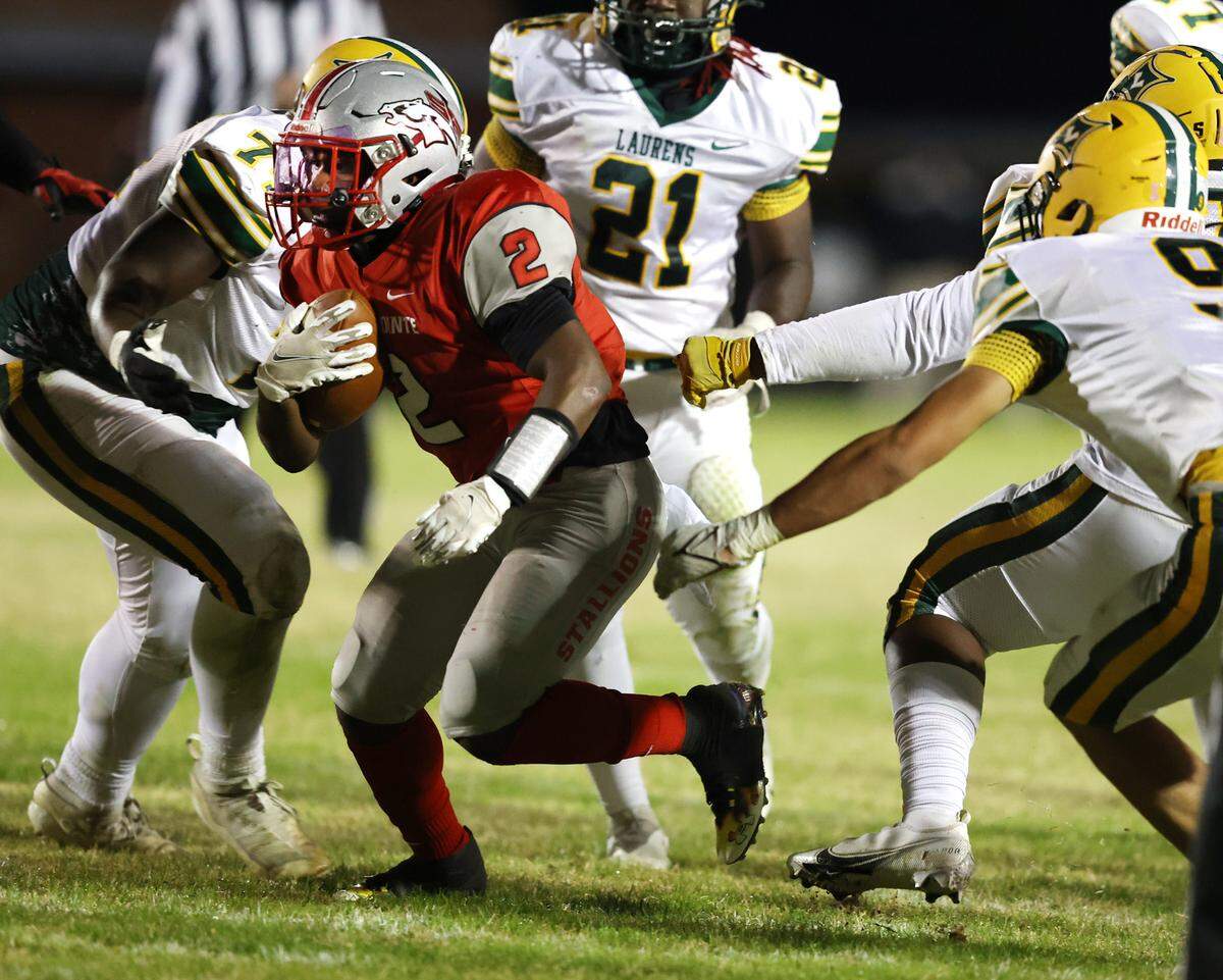 South Pointe hosted Laurens in the second round of the state playoffs November12, 2021. Caleb Sims breaks away from Laurens defenders to score for the Stallions in the first quarter. Andy Burriss-Special to The Herald