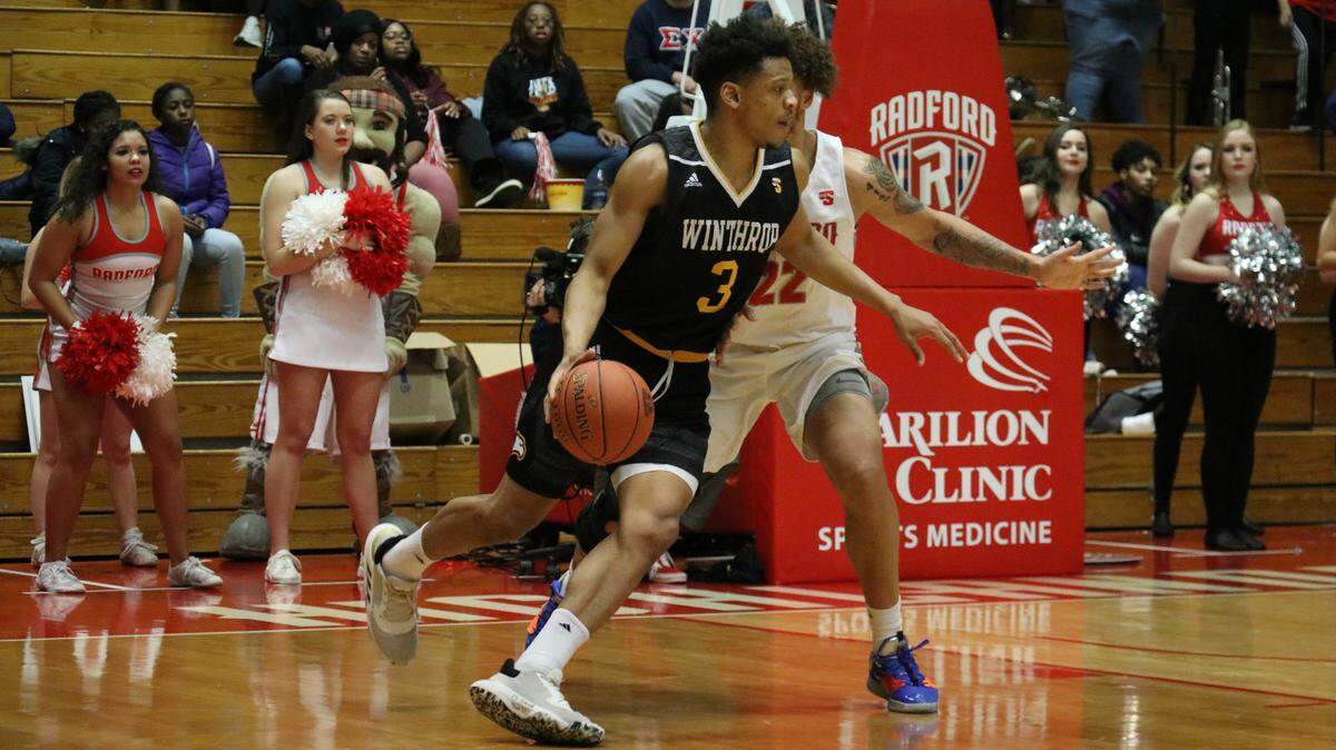 Winthrop’s Micheal Anumba tries to turn the corner around a Radford defender on the road on Jan. 20, 2020. The Eagles won the conference matchup, 61-56.