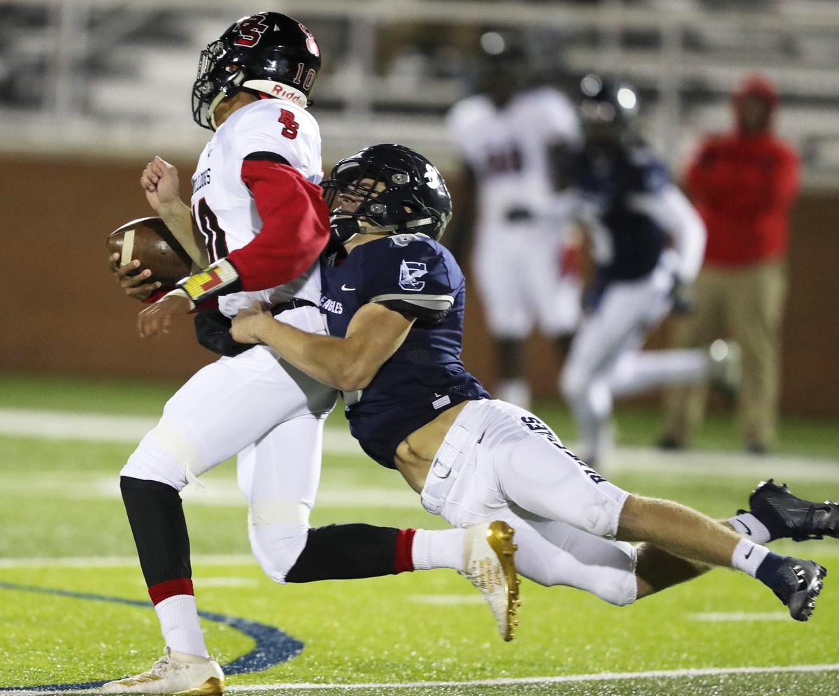 Clover’s Hayden Johnson takes down Boiling Springs quarterback Jalen Dodd.