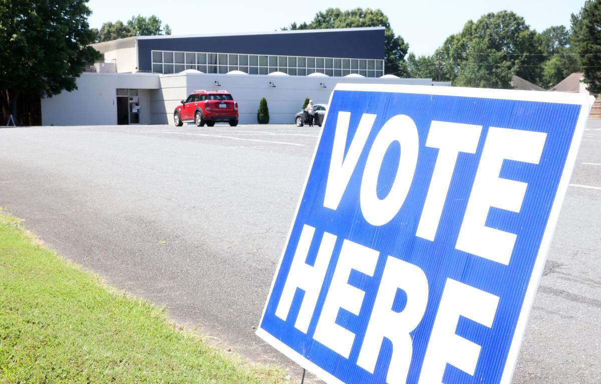 A “vote here” sign lets voters kow where their precinct is located at Tega Cay Baptist Church Tuesday.