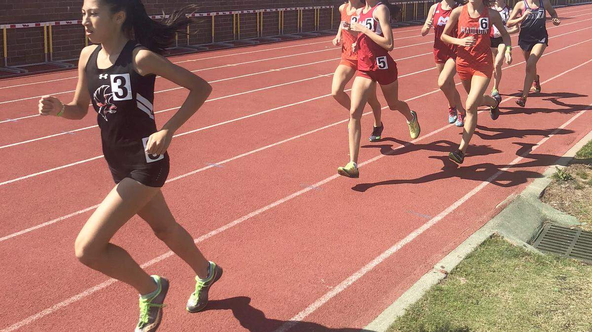 Nation Ford’s Katie Pou leads the 1,600 meters during the 5A state track meet last spring. Pou, a sophomore, will help lead Nation Ford in cross country this summer and fall.