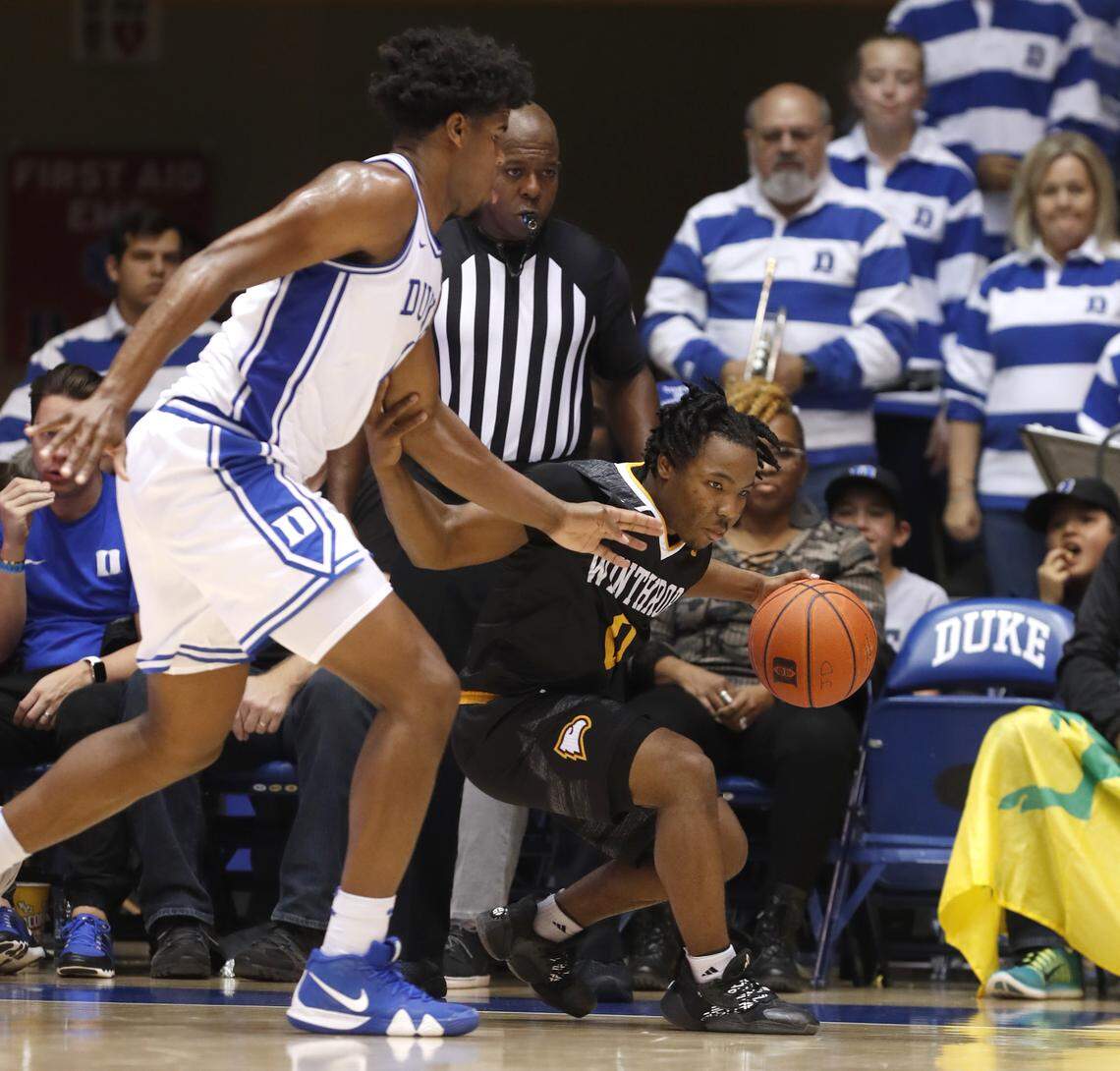 Winthrop’s Russell Jones Jr. drives around Duke’s Vernon Carey Jr. (1) during the second half of Duke’s 83-70 victory over Winthrop at Cameron Indoor Stadium in Durham, N.C., Friday, November 29, 2019.