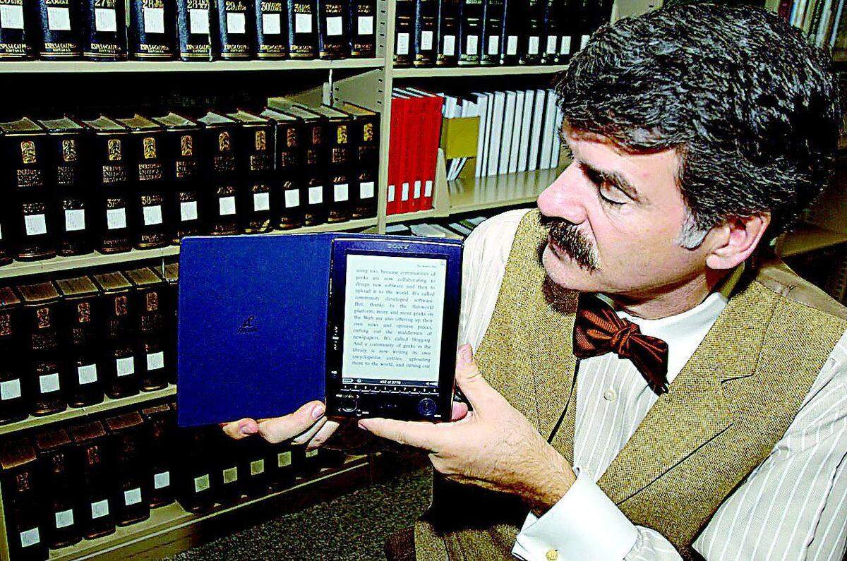 Mark Herring, dean of library services at Winthrop University, shows a Sony Reader, a so-called “e-book,” the library is trying out. The unit is capable of storing 80 books.