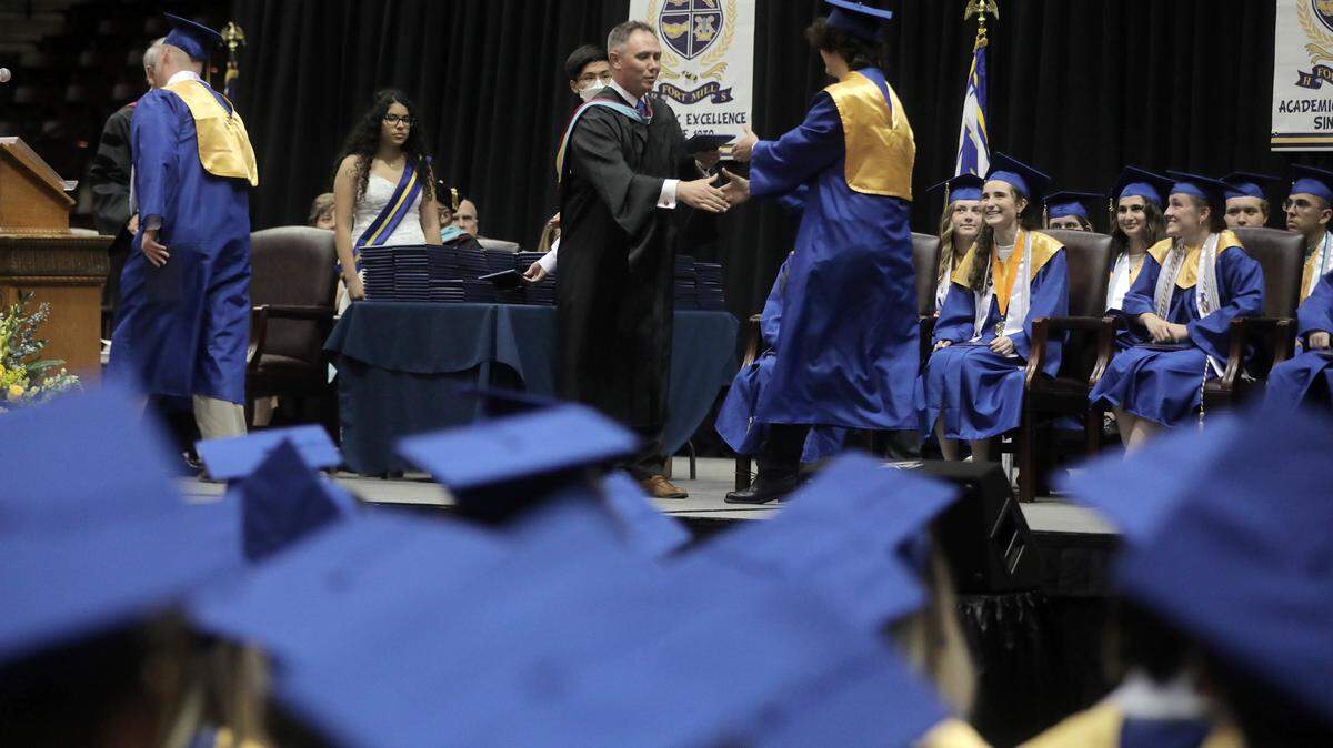 Fort Mill High School graduating seniors watch the graduation ceremony Saturday at the Winthrop Coliseum.