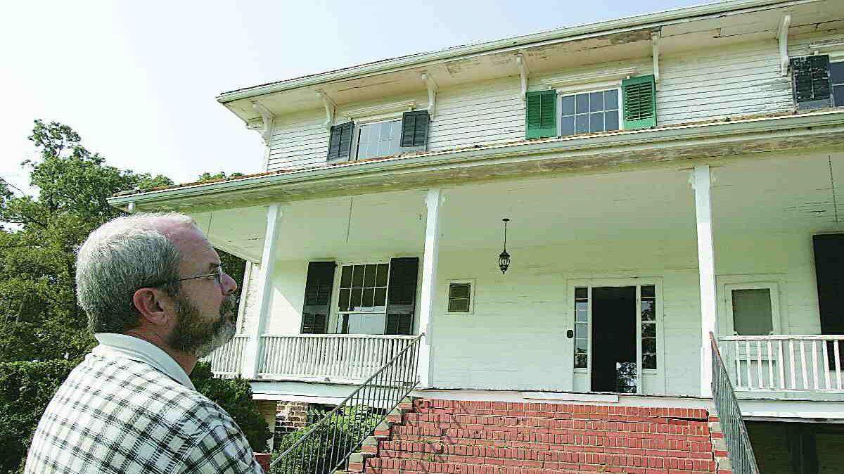 Frank Couch, operation manager for the Culture & Heritage Museums, looks at the back of Hightower Hall at Historic Brattonsville. The brick steps are to replaced with wood that was original to the 1850's-era villa. Work on the villa's windows, doors and shutters is being hurried along by a $20,000 state preservation grant helping to fund the $98,000 project.