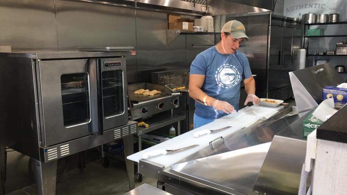 Clint Boyd, pictured here, and his wife Elizabeth plan to open their Clover restaurant, The Po Boy, Tuesday, Oct. 9.