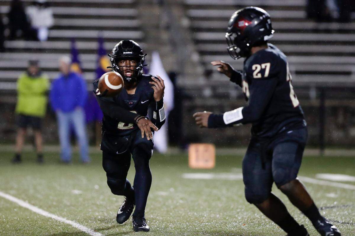 Rock Hill quarterback (2) Matthew Wilson delivers a sovel pass to Rock Hill’s (27) Damaryion Pichardo in first half play as Northwestern takes on Rock Hill in Friday night varsity football action, 10-29-2021.