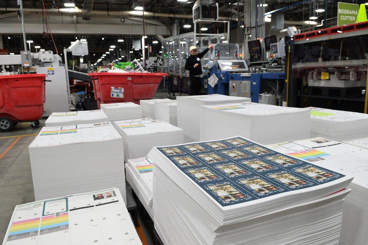 Pallets of finished Christmas cards await cutting at Shutterfly.
