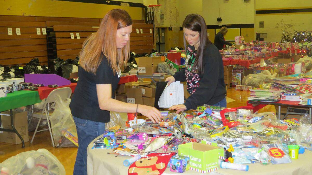 Volunteers sort through toys donated to United Way of York County’s Holiday Partners Program. The program will begin taking applications this month in York County. Last year more than 1,800 local children received gifts through this community supported effort.