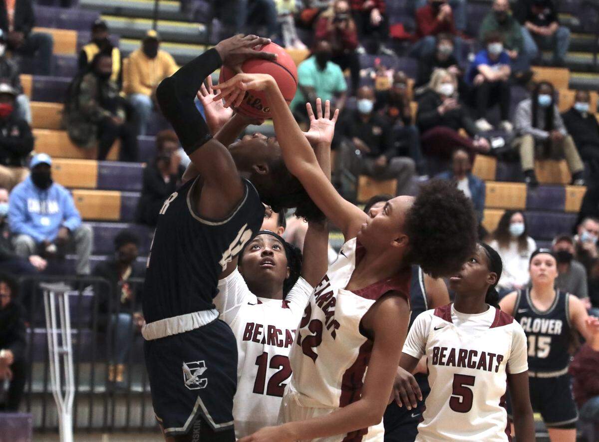 Clover’s Aylesha Wade makes the shot as Rock Hill’s Jada Jones, middle and Makayla Street defend.