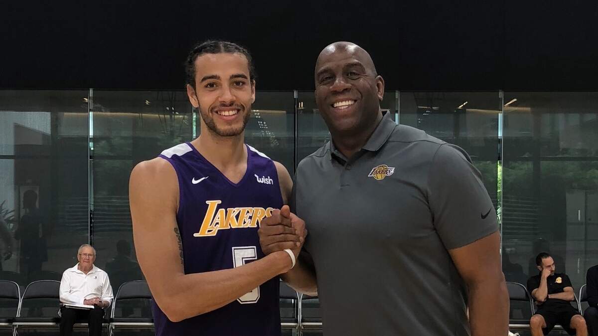 Former Winthrop basketball star Xavier Cooks is busy working out for NBA teams, and, on occasion, taking photos with NBA celebrities, like Los Angeles Lakers president of basketball operations and Hall of Famer Magic Johnson.
