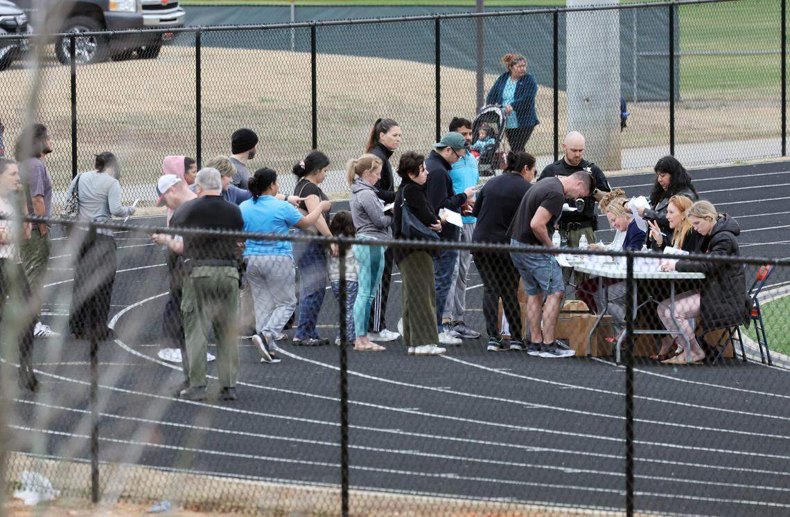 Parents line up to pick up their kids at Pleasant Knoll Elementary after Flint Hill Elementary closed following a second chemical spill this week at Silfab Solar on Thursday, March 5, 2026.