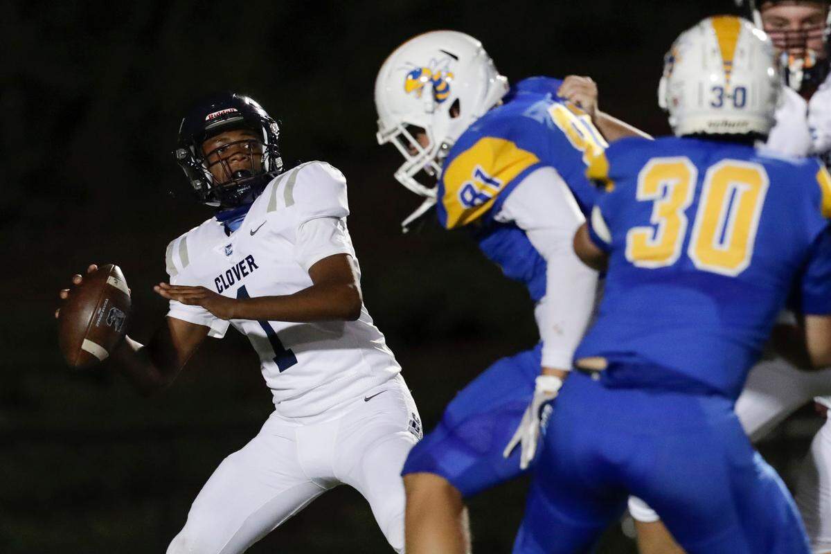 Clover’s #1 Joe Boyd looks to launch a pass as Fort Mill hosts Clover in Friday night Varsity football, 10-2-2020.