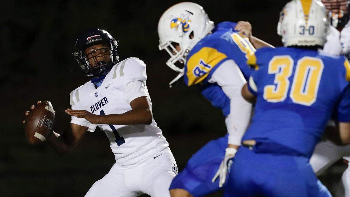 Clover’s #1 Joe Boyd looks to launch a pass as Fort Mill hosts Clover in Friday night Varsity football, 10-2-2020.