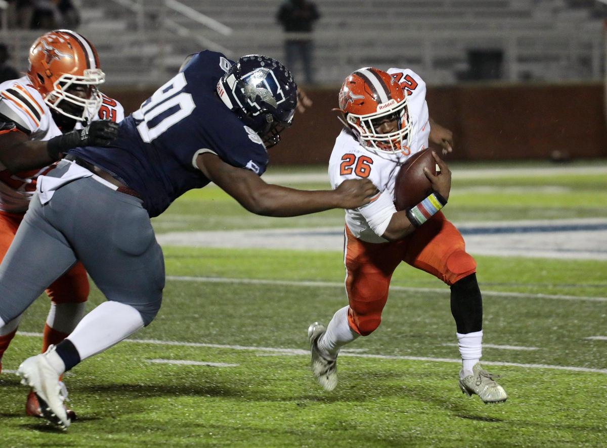 Mauldin’s Jordon Franklin carries the ball against Clover’s Jaquarius Guinn (90) as the Blue Eagles take on the Mavericks in Clover.