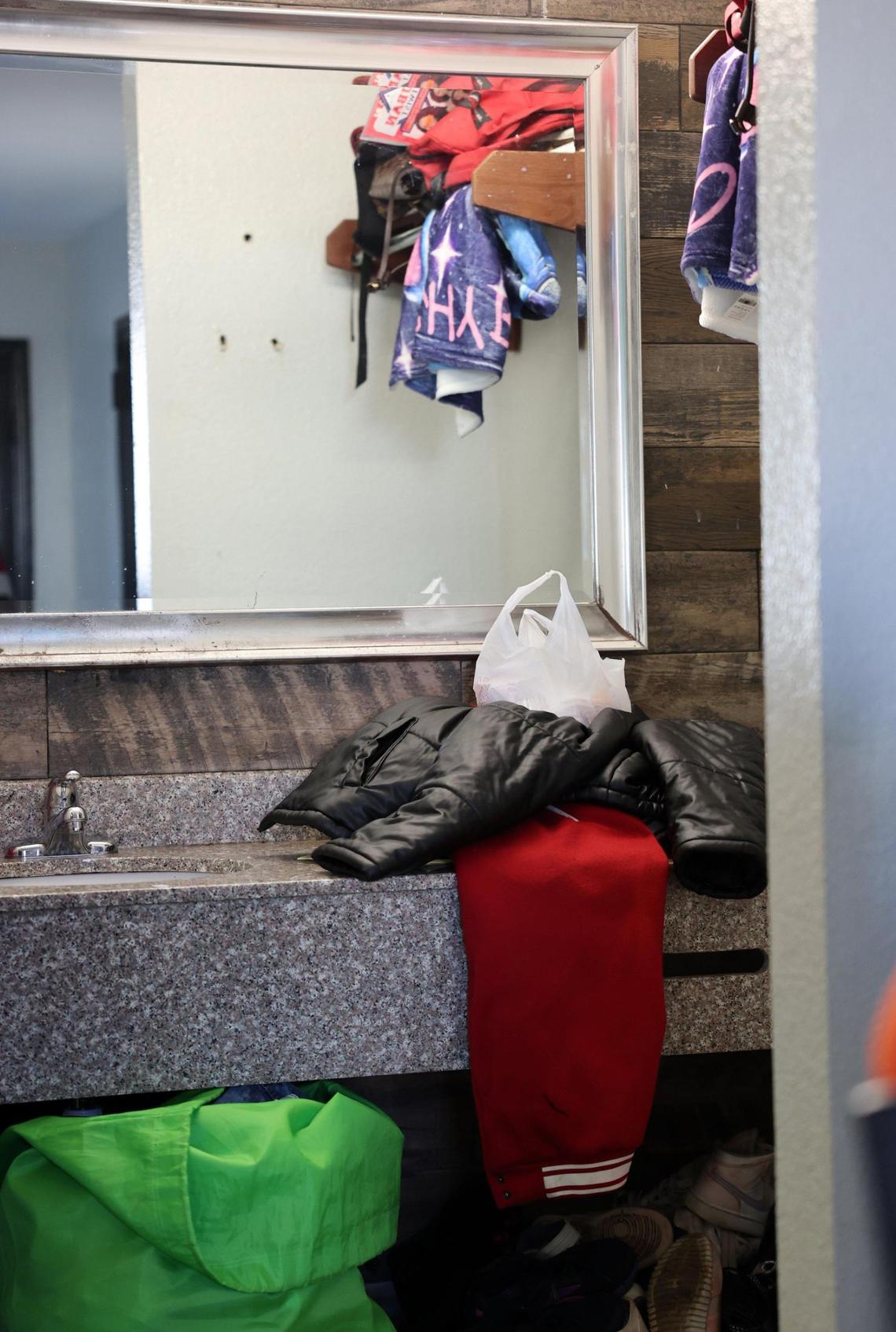 Clothes and bags are stored in the room of Quenanecha Williams.