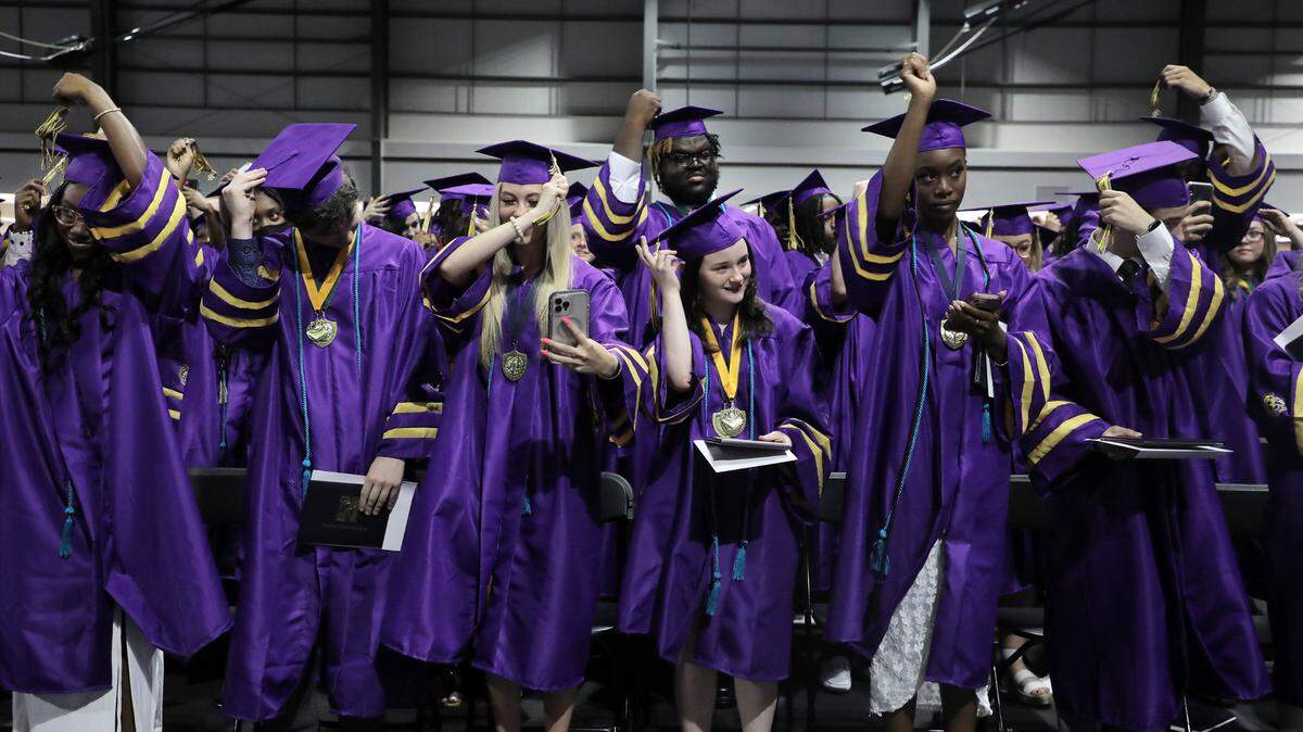 Northwestern High School graduates move their tassles Friday at commencement at the Rock Hill Sports and Event Center.