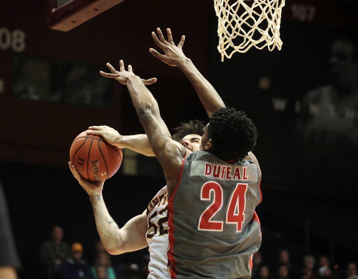 Winthrop’s Chandler Vaudrin tries to take the shot around Gardner-Webb’s Ludovic Dufeal Saturday, Jan. 11, 2020 at Winthrop Coliseum in Rock Hill, S.C.