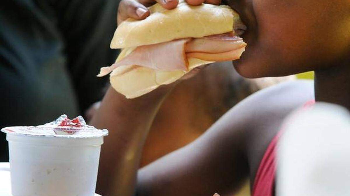 Children gathered last summer in a covered pavilion outside the Boyd Hill Recreation Center in Rock Hill to enjoy free meals. This year's Summer Feeding Program starts Monday in York County.