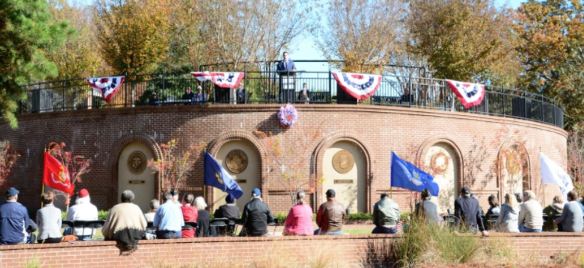 Rock Hill residents gather in this file photo to honor veterans at the Memorial Wall in Glencairn Garden in Rock Hill.