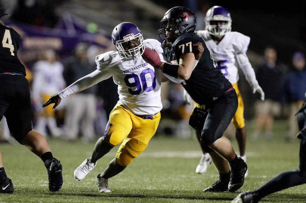 Northwestern (90) Joseph Grant works against Rock Hill’s (77) Hunter Melton in second half action as Northwestern takes on Rock Hill in Friday night varsity football action, 10-29-2021.