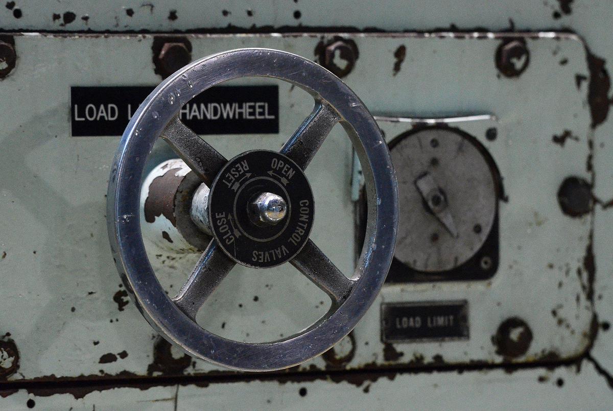 A hand wheel on Unit 1 shows its age and use. Only one of five power production units is still in operation at Allen Steam Station in Gaston County, and it will close by the end of December.