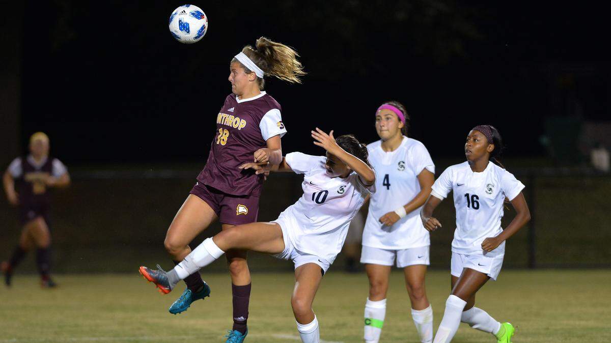 Lexi Sheely rises for a header during Winthrop’s game against South Carolina State in August.