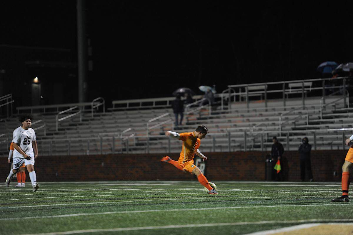 Nate Clark kicks in a recent game. The senior is a key offensive threat for the Copperheads this season.