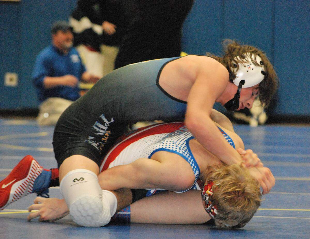 Fort Mill’s Joshua Sturgeon wrestles during the finals of the Kingsley Holiday Classic, where he would go on to win the 126-pound weight class.