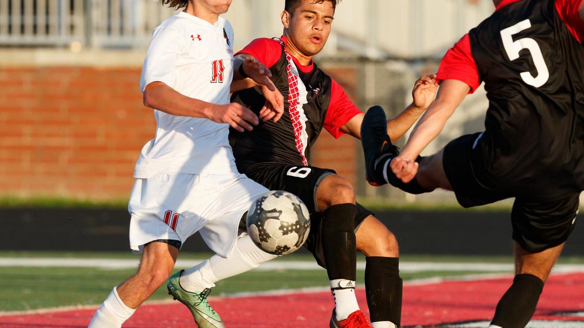 Nation Ford's Carter Jarrett (11) battles a tough Hillcrest defense in front of the net as Nation Ford advances with a 2-1 win against Hillcrest in the SCHSL Upper State 5A Boys Soccer playoffs May 1, 2018.