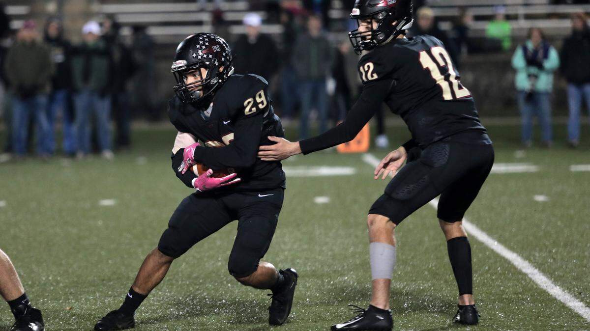 Rock Hill’s Hayden Jackson (12) helps Noah Thompson find an opening.