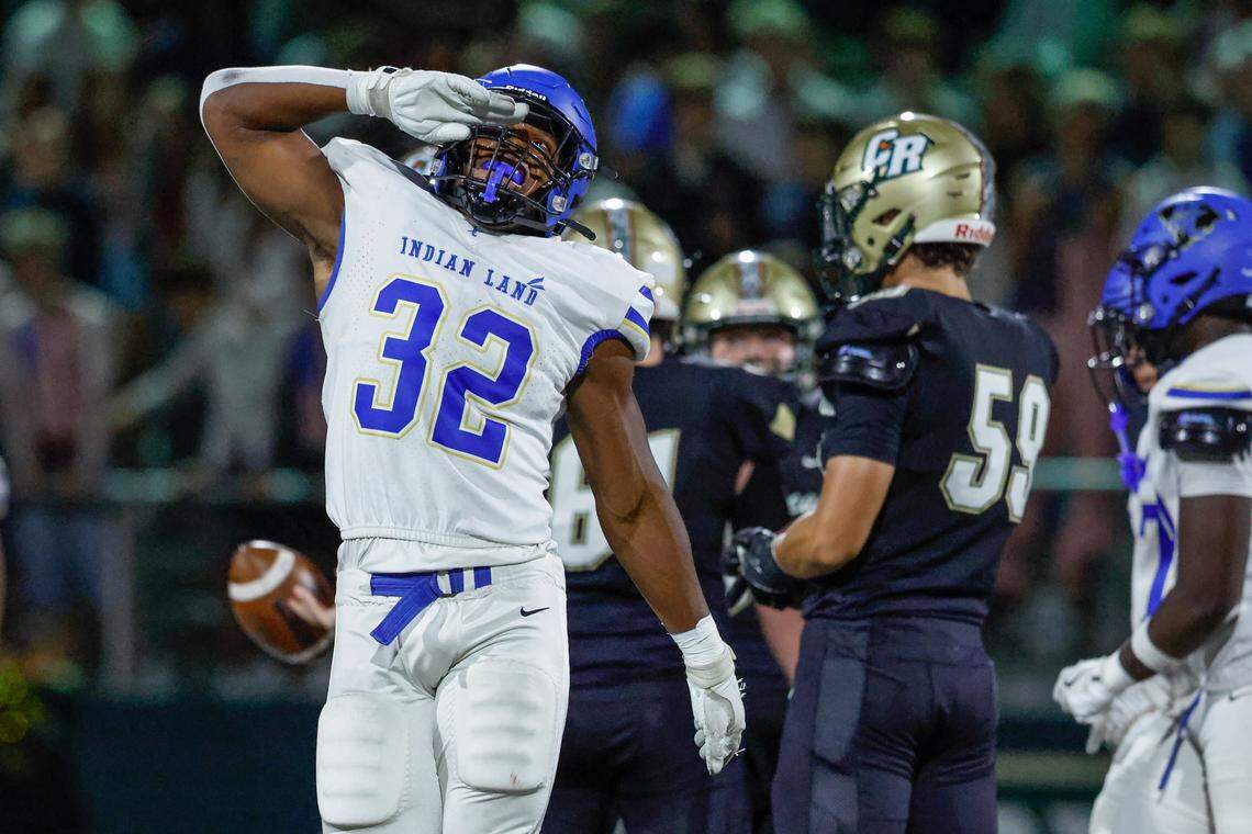 Indian Land’s Michael Foster (32) celebrates a stop for he undefeated Warriors earlier this season.