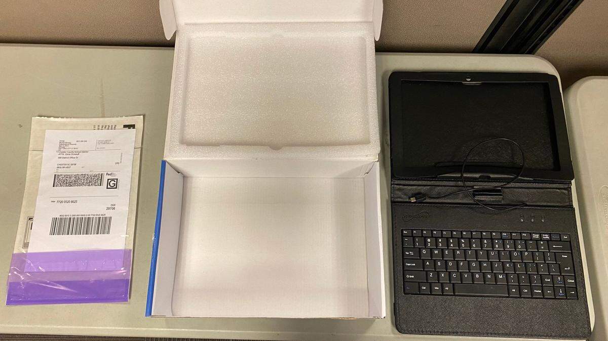 Tablets being prepared for shipping. The tablets were cleaned up and re-imaged before they were donated.