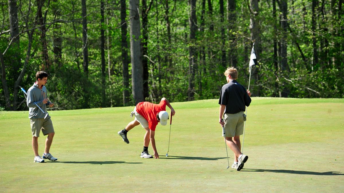 Nation Ford's David King, South Pointe's Isaac Harvell and Fort Mill's Michael Wheeler play Thursday at Springfield Golf Club. The Falcons won the three-way match.