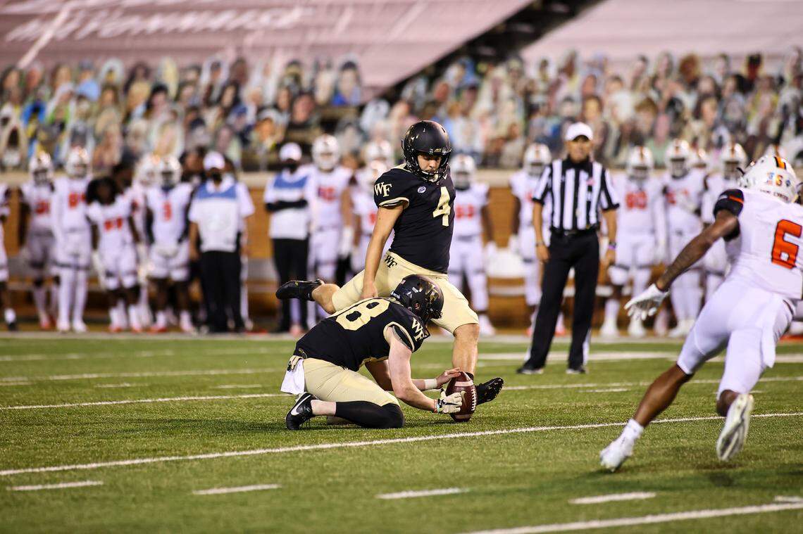 Nick Sciba, kicker for Wake Forest, lines up a kick against Syracuse in an almost empty stadium.