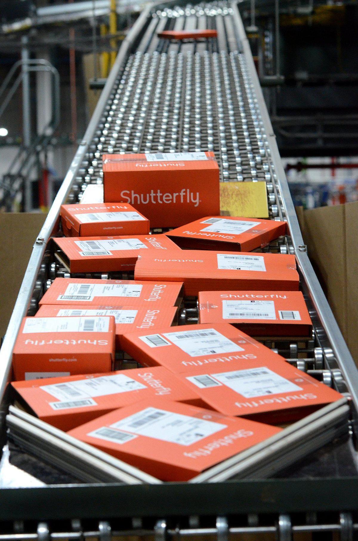 Sorted Shutterfly packages await being loaded on to trucks for shipping. The Fort Mill production sites uses several delivery carriers, and UPS as its primary one takes several truckloads of photo items each day during the holiday season rush.