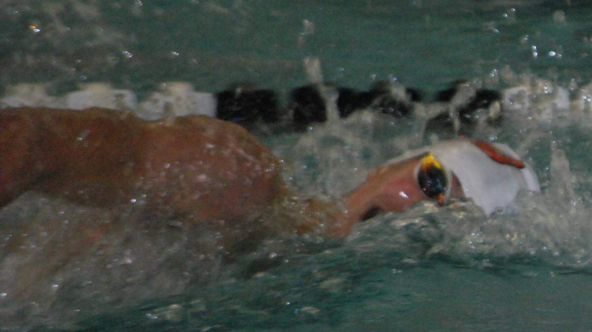 Nation Ford’s Austin Lockhart swims the 100-yard freestyle during the 5A state meet.