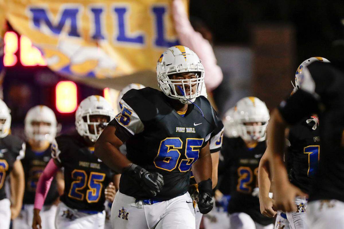 Fort Mill hosts Nation Ford in a cross town football rivalry Friday, October 1, 2021. Marcus Boston Brinkley (#65) runs out of the tunnel.