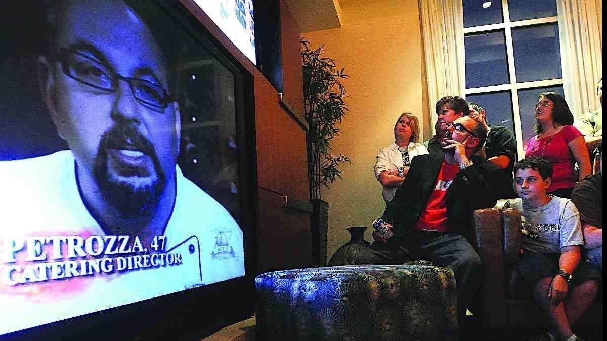 Louis Petrozza watches the finale of "Hell's Kitchen" with family and friends Tuesday night in Charlotte.