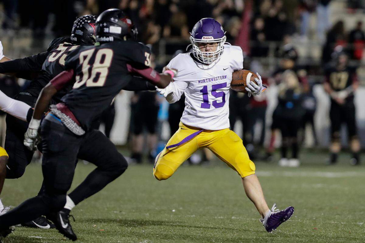 Northwestern’s (15) Ben Gregory carries the ball in late play as Northwestern takes on Rock Hill in Friday night varsity football action, 10-29-2021.
