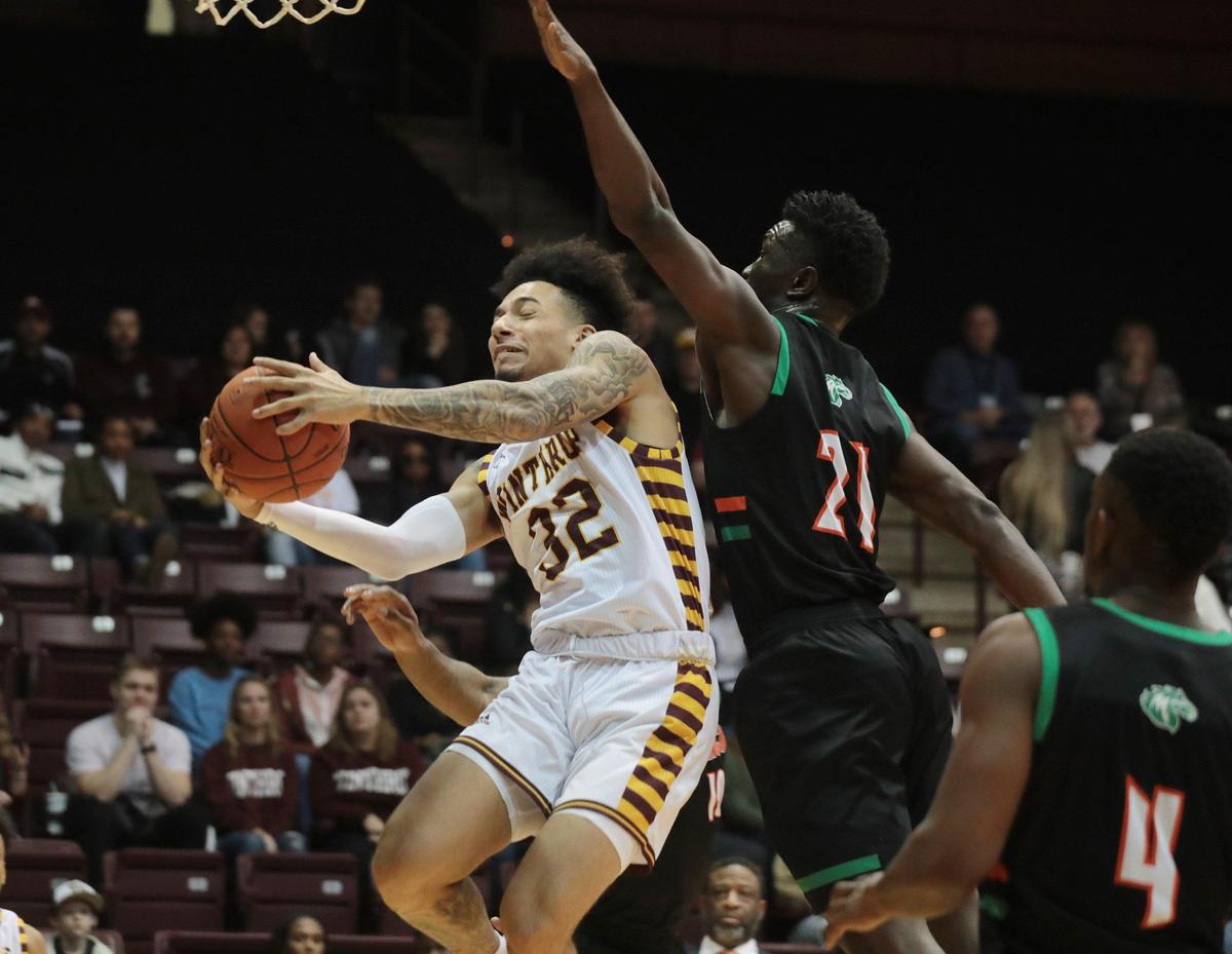Winthrop’s Josh Corbin heads for the basket ahead of Mid-Atlantic’s Coleman Agbo Saturday at the Winthrop Coliseum.