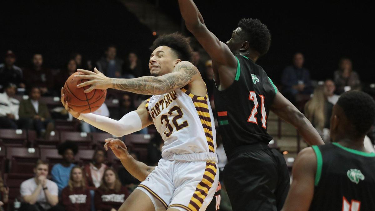 Winthrop’s Josh Corbin heads for the basket ahead of Mid-Atlantic’s Coleman Agbo Saturday at the Winthrop Coliseum.