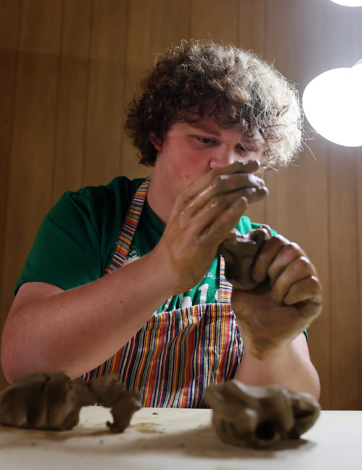 Kenneth Harris molds a piece of clay Wednesday, July 30 at the Catawba Reservation where he took a 7-week pottery class with former Chief Bill Harris.