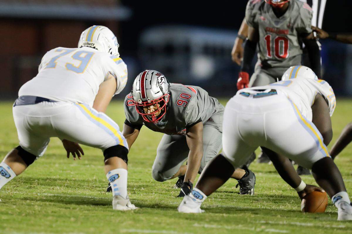 South Pointe’s (90) Anquerrious Davis targets his opponent as the South Pointe Stallions host the South Florence Bruins in Friday night football action, 9-17-2021.