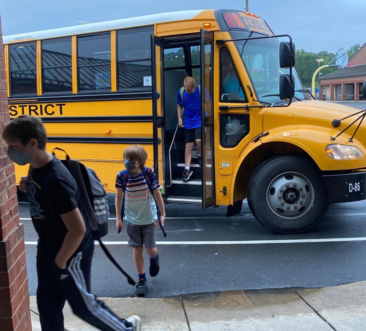 Students head to school Monday at Gold Hill Middle School.